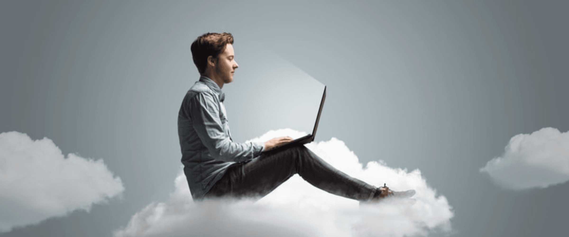 Man on cloud with laptop