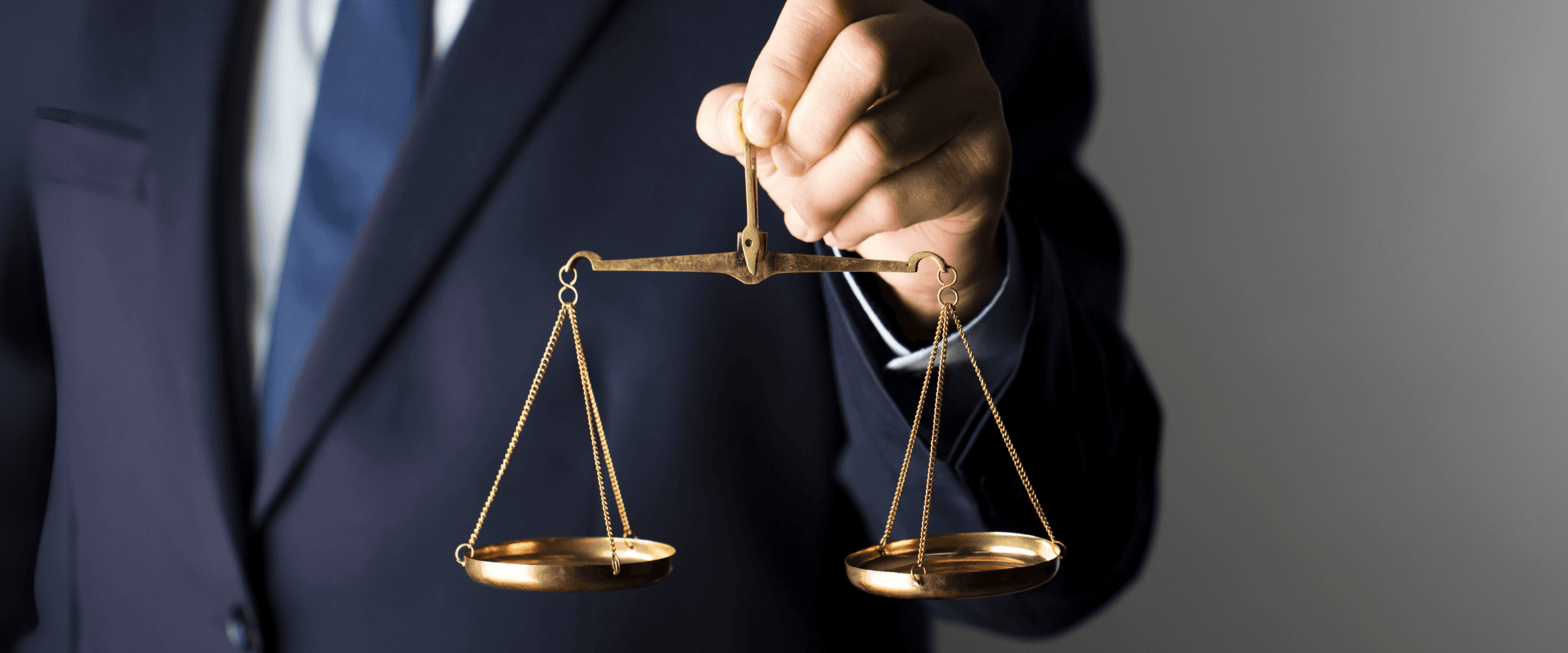 Lawyer holding scale of justice.